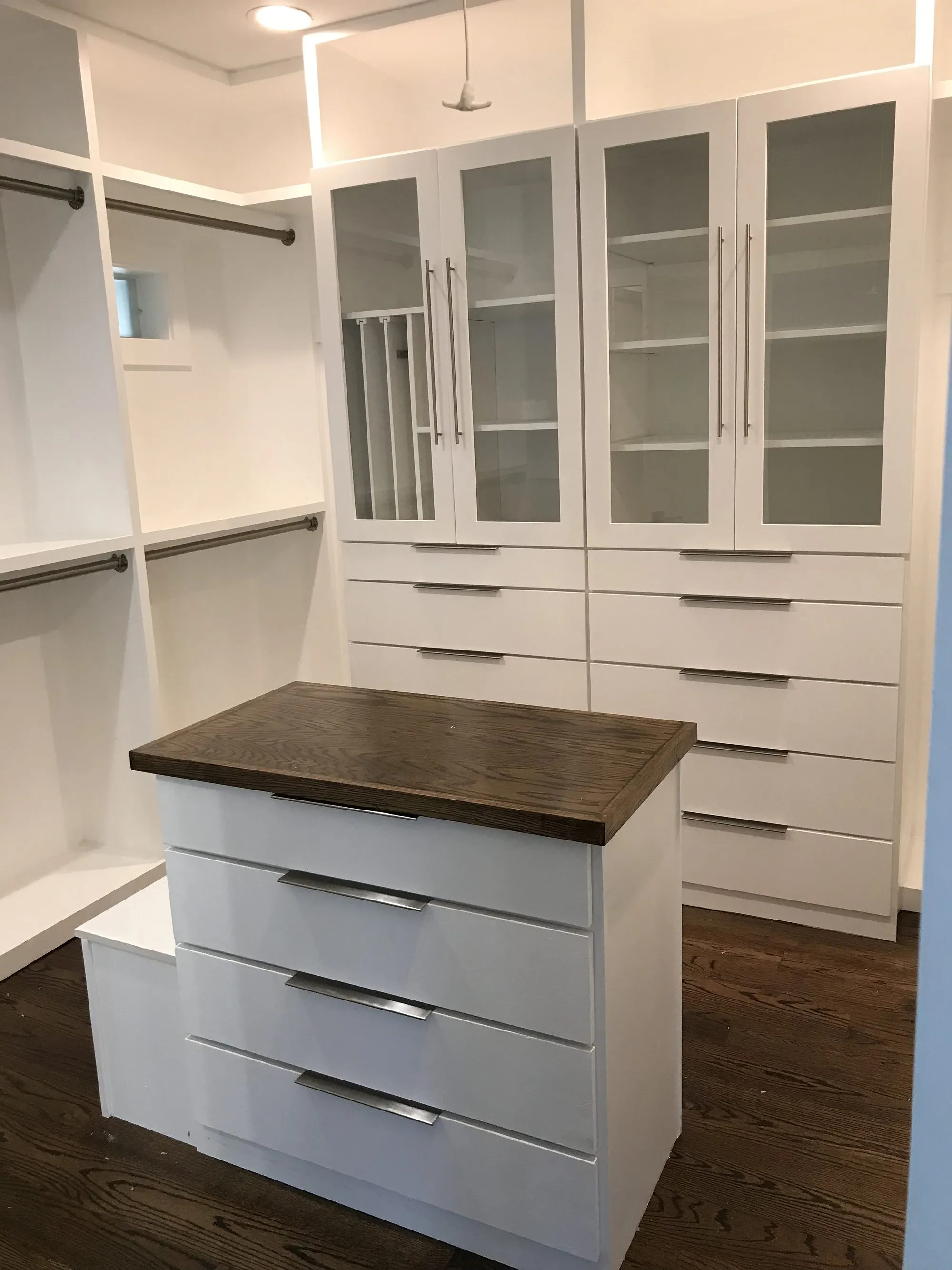 Custom built-in closet cabinetry and shelving by Building America Construction
